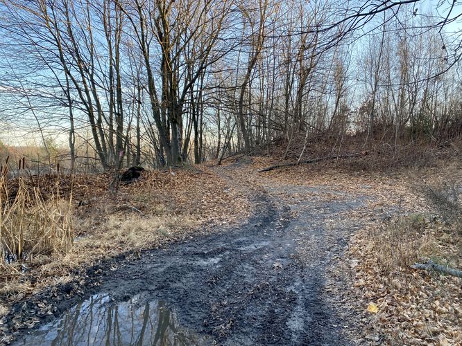 Muddy trail leads around the side entrance to Old PA-61