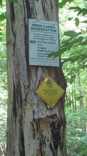 Conservation sign with reminders of forbidden activities