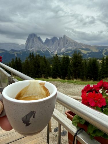 Enjoying an after-hike espresso with a view of the Langkofel Group massif