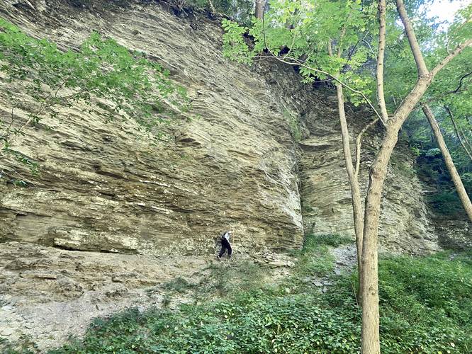 Sam Monks hikes the right-hand cliff at Amphitheater Falls