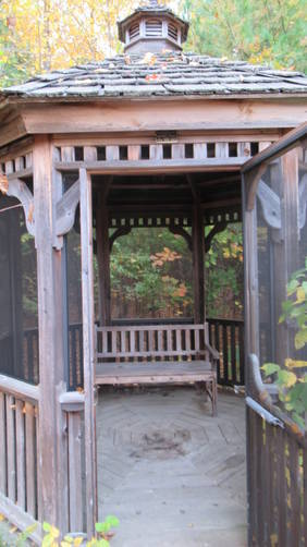 Screened gazebo with a welcoming bench atop Hooper Hill