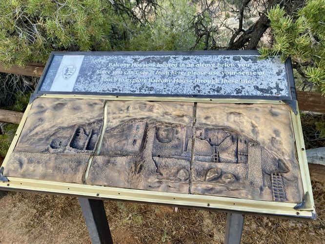 Balcony House is in the cliff below your feet - use this sign to understand the architecture