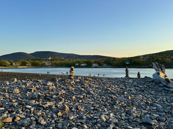 Stone cairns sit on Bar Island with a view of Cadillac Mountain