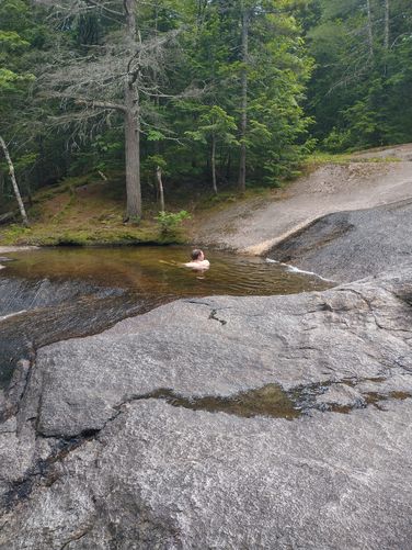 Local visitor enjoying a dip in a pool along the Lower Falls