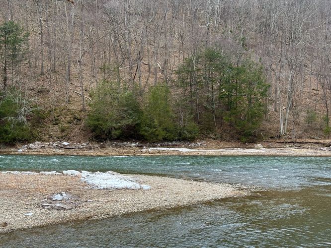 Ice chunks sitting on an island within Pine Creek