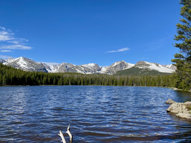 View of Bierstadt Lake and snow-capped rocky mountains