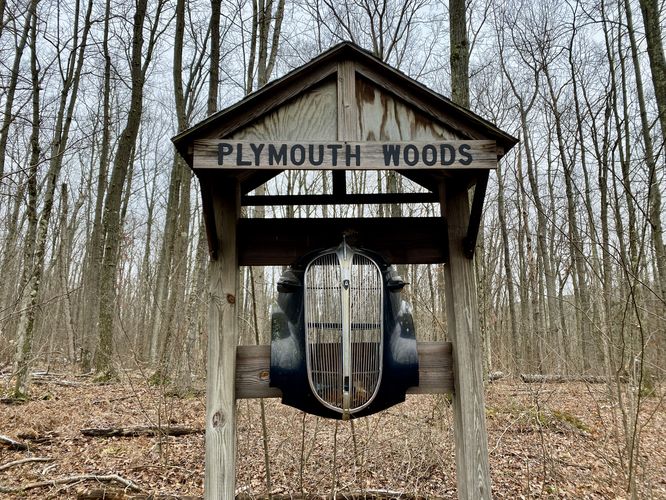 Plymouth Woods sign (old Plymouth car grill)