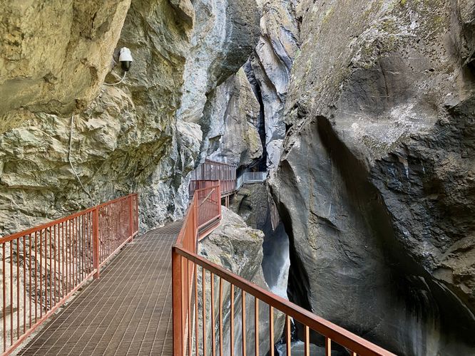 Trail follows a suspended metal path out to Box Canyon Falls