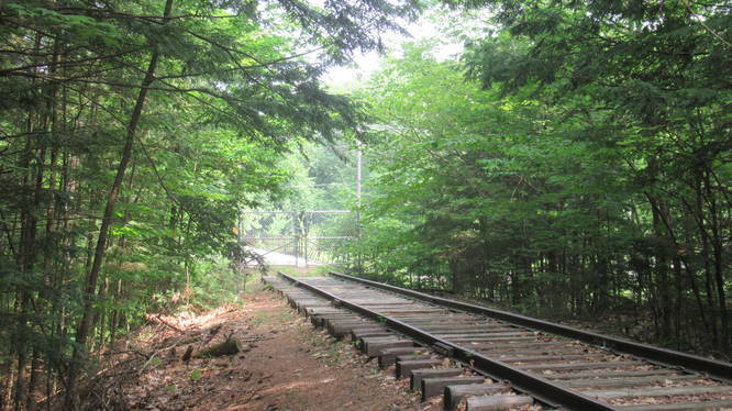 The trail does not extend all the way down the tracks and hikers are stopped by a chain link fence