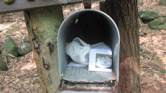 Mail box with trashbags and maps