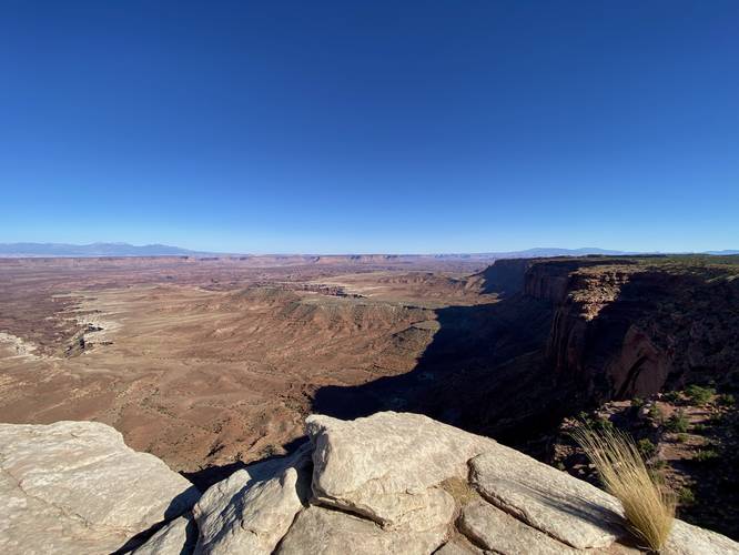 View of Buck Canyon (left) and rock cliffs of Canyonlands National Park (right)