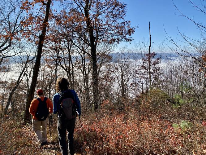 Hiking down the Chimney Rock Trail with fog in the PA Grand Canyon below