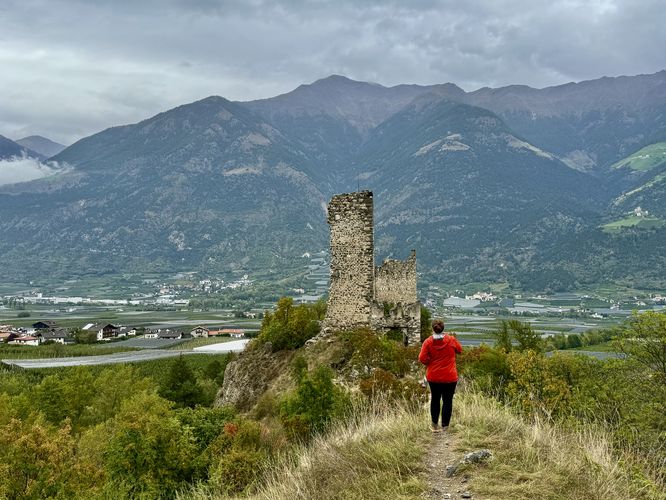 Standing on the trail to Castel Montani di Sotto with a backdrop of the Italian Alps, South Tyrol
