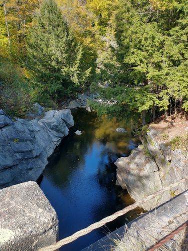 View from the bridge down towards the pool before the Upper Falls 