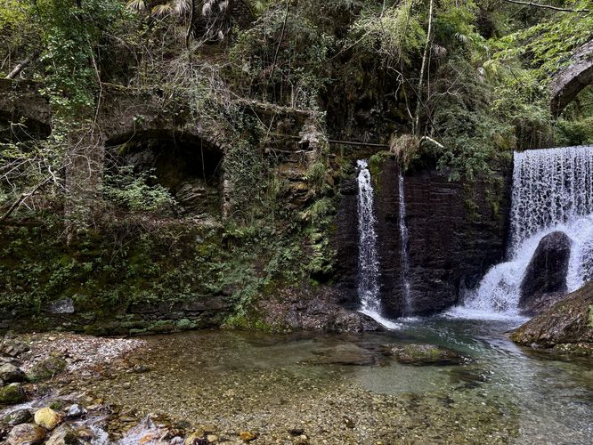 Stone archways of an old aqueduct