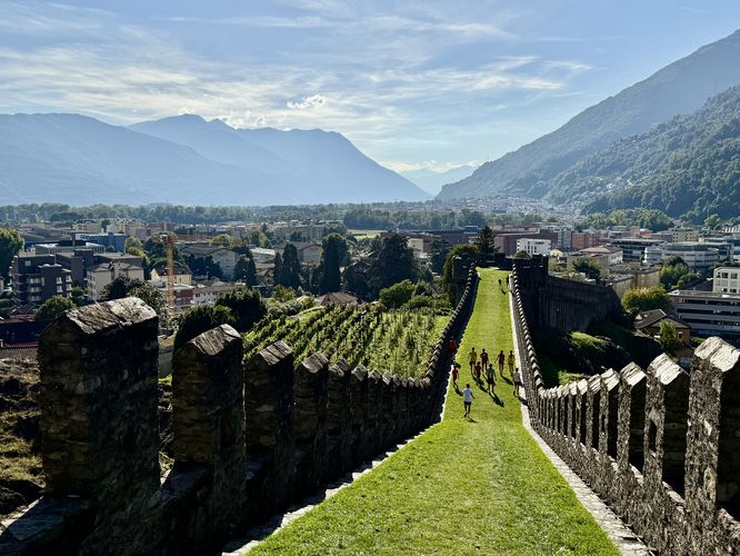 Football team runs for exercise on Castel Grande's murata