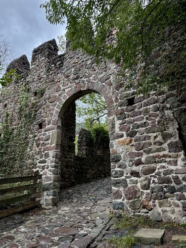 Castel Roncolo's outer stone walls on the trail