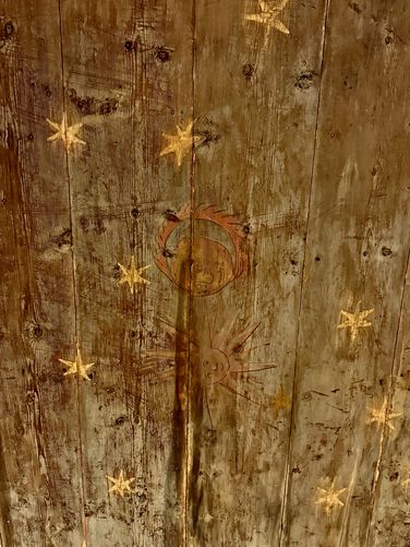 Original wood floor/ceiling of the castle with stars, moon, and sun (12th century)