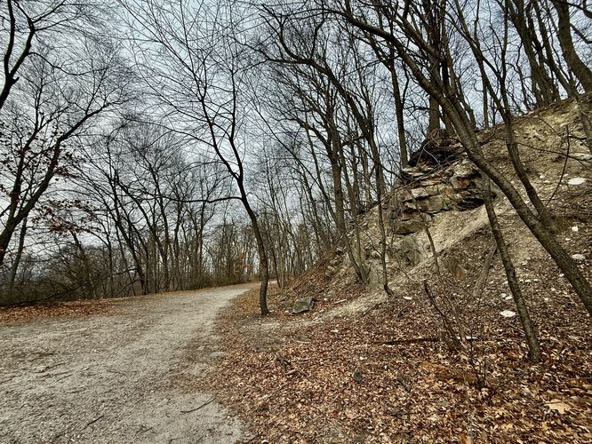 Flat trail passes steep bluffs