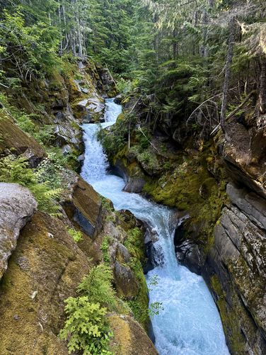 Portrait view of the turquoise-tinted waterfalls of Upper Christine Falls