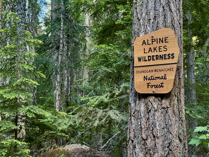 Close-up photo of the Alpine Lakes Wilderness sign