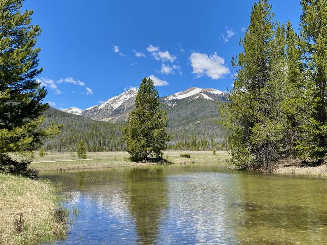 View of Mount Cindy (center) and Mount Nimbus (right) with water reflection