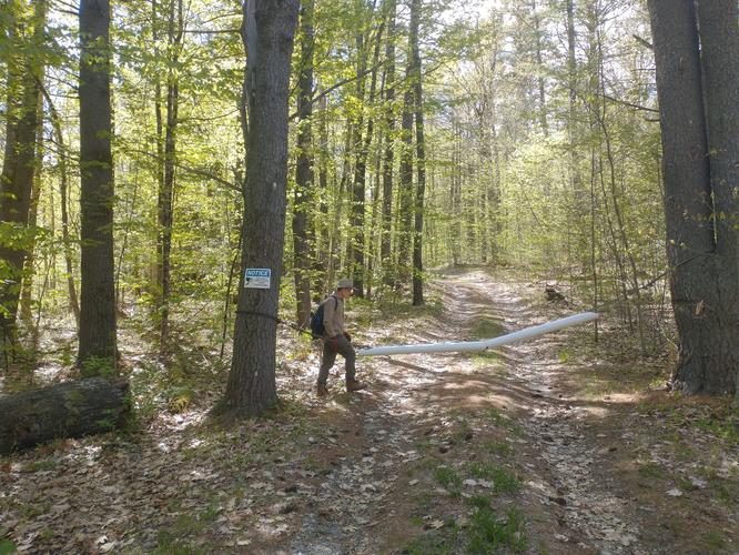 Past the gate and down the trail . Hoping to find the abandoned Chickering Feldspar Mine 