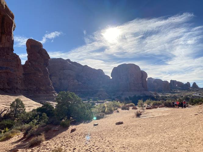 Hiking out under the desert sun from Double Arch