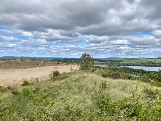 View of Lake Michigan, a darm, dunes, and Little Glen Lake from the Dune Overlook