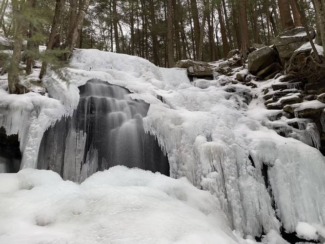 Dutchman Falls long exposure frozen in winter. Approx. 25 to 30 feet tall