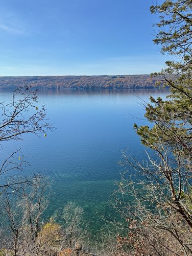 View of Cayuga Lake with turquoise waters below from Edwards Lake Cliffs