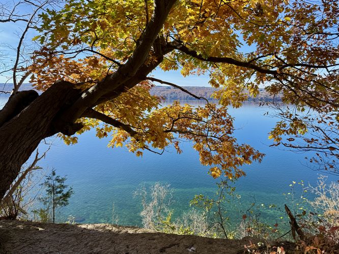 View of Cayuga Lake with turquoise waters below from Edwards Lake Cliffs