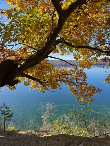 View of Cayuga Lake with turquoise waters below from Edwards Lake Cliffs
