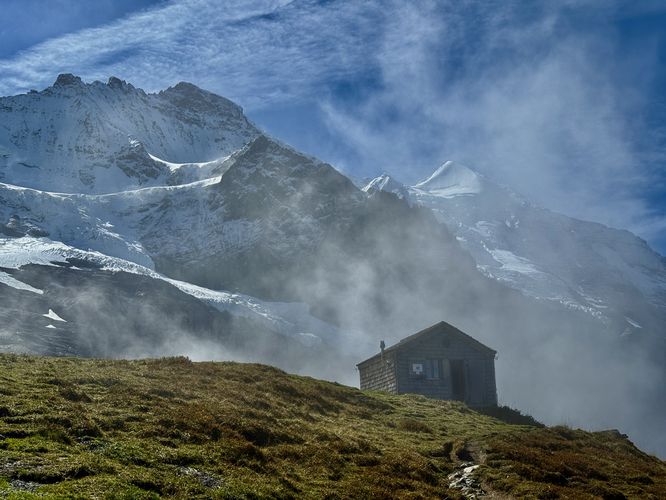 Alte Mittellegihütte (Old Mittellegi Hut) sits below the Junfraujoch along the Eiger Walk Trail