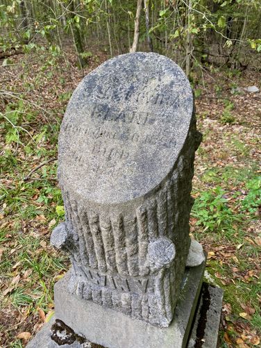 Beautiful headstone, shaped like a cross-cut of a tree