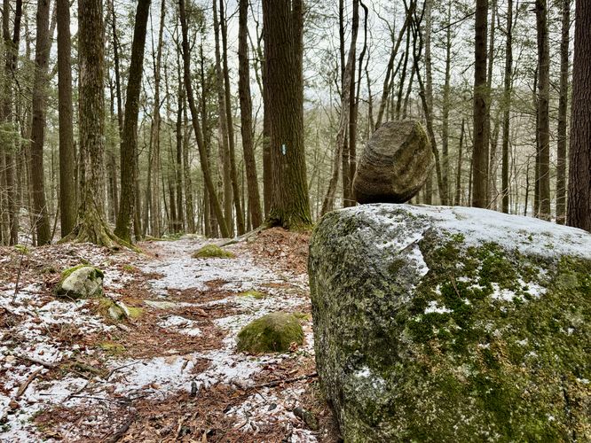 Balanced rock ontop of a boulder