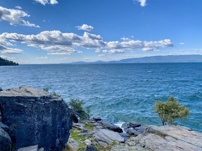 Bedrock in the foreground with views of Flathead Lake