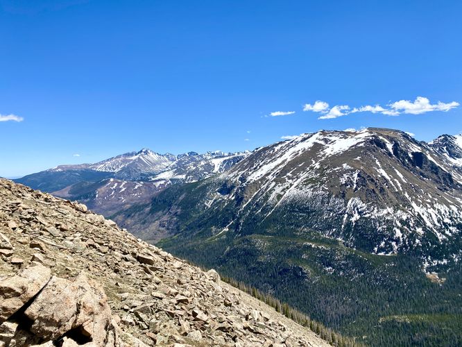 View of snow-capped Rocky Mountains from the Forest Canyon Overlook