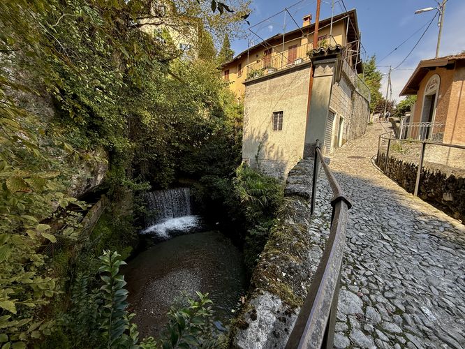 Via Loveno and a view of the Menaggio Mini Waterfall