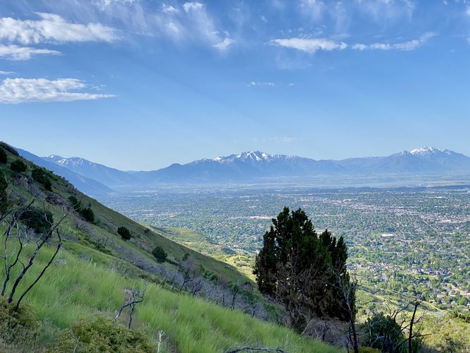 Steep slopes of the mountain with views of distant mountians