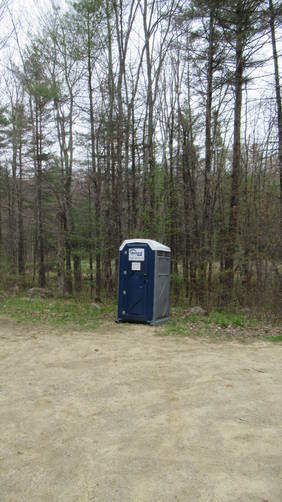 Port-a-potty in parking area