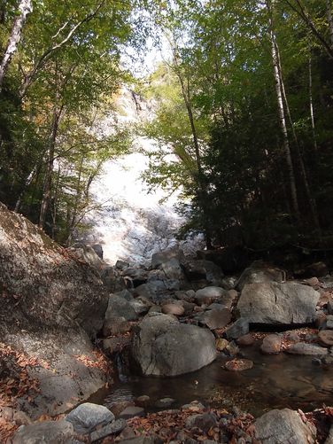 Distant waterfall from the trail at base