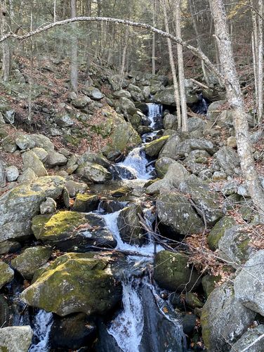 Goldmine Brook cascades as viewed from US-20