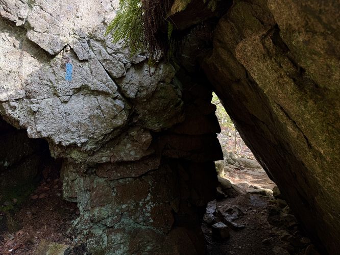 Trail passes through a rock tunnel