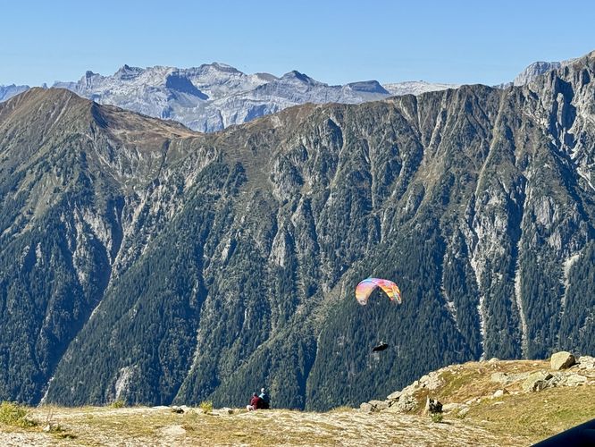 Paragliders launch from Plan de l'Aiguille