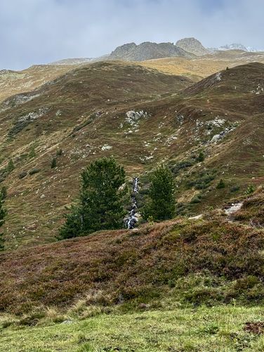 Waterfall tumbles into Flüela Pass at the Grand Tour of Switzerland lookout point