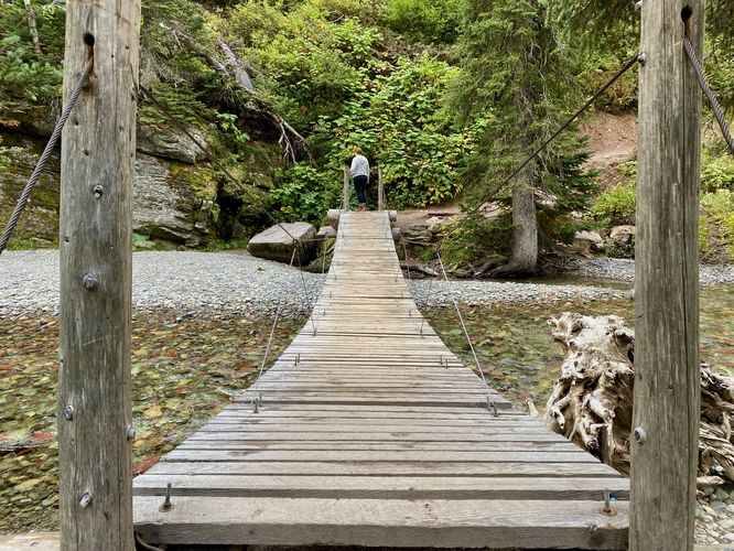 Suspension bridge with scenic creek below
