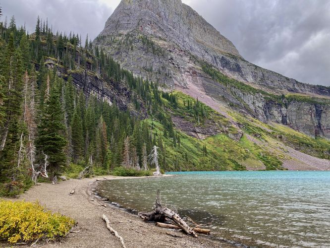 Angel Wing peak towers over turquoise waters of Grinnell Lake