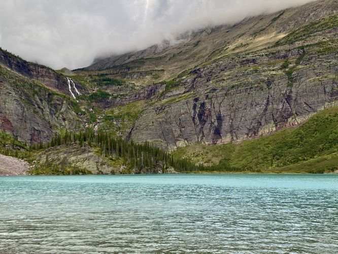 View of 960-foot tall Grinnell Falls at Grinnell Lake