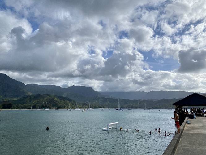 View of Hanalei Pier and surrounding mountains, facing west